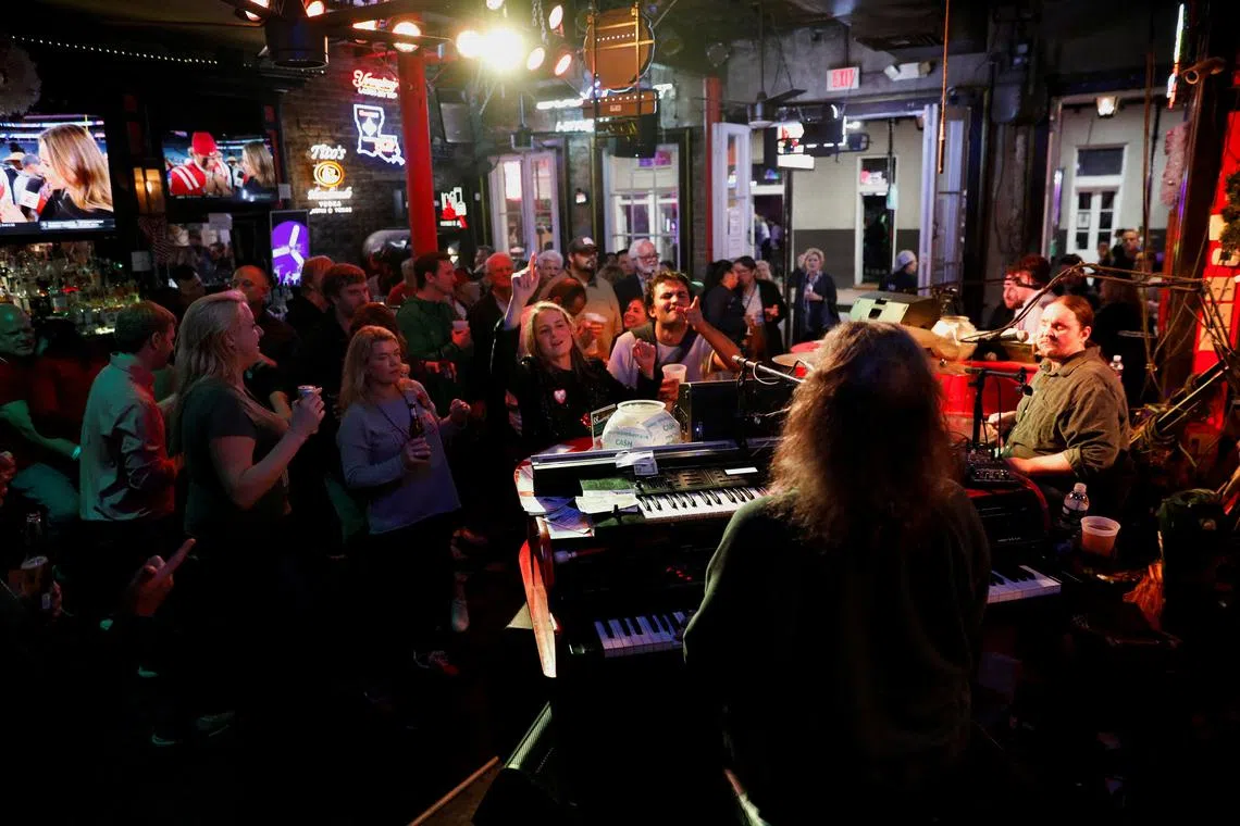 FILE PHOTO: Brian Lee plays the piano with his band at Ticklers Piano Show on Bourbon Street, following the opening of the street, on the day of 2025 Sugar Bowl, after people were killed by a man driving a truck in an attack during New Year's celebrations, in New Orleans, Louisiana, U.S., January 2, 2025. REUTERS/Octavio Jones/File Photo