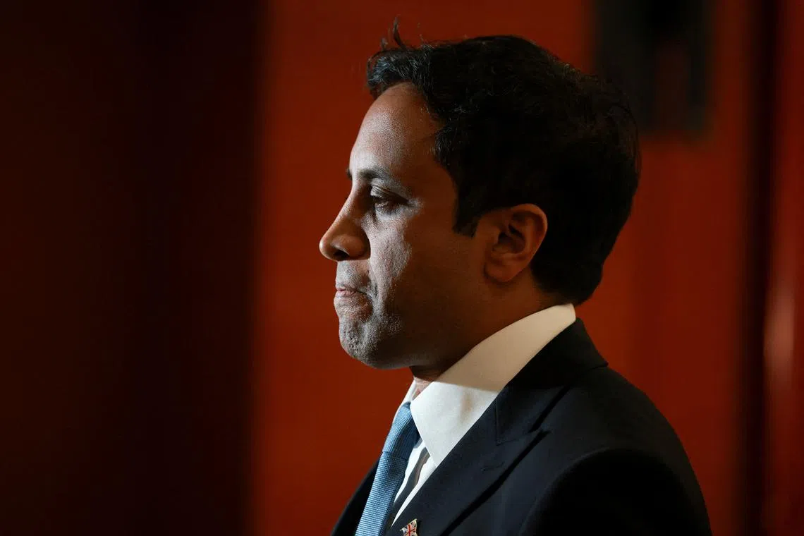 FILE PHOTO: Zia Yusuf, Chairman of the Reform party, looks on as he is interviewed by the media on the day of the Runcorn and Helsby by-election, in Widnes, Britain, May 1, 2025. REUTERS/Phil Noble/File Photo