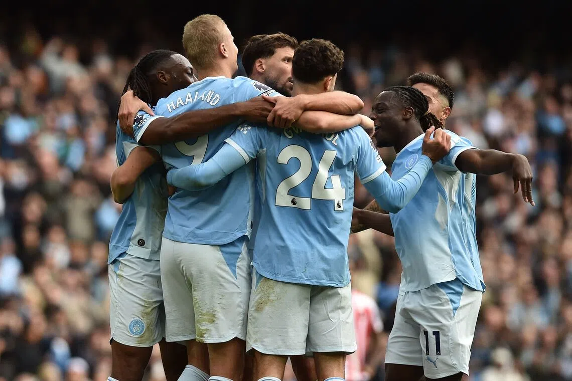 Manchester City’s Norwegian striker Erling Haaland (second from left) celebrates with teammates after scoring their fifth goal against Sunderland at the Etihad Stadium in Manchester, England.