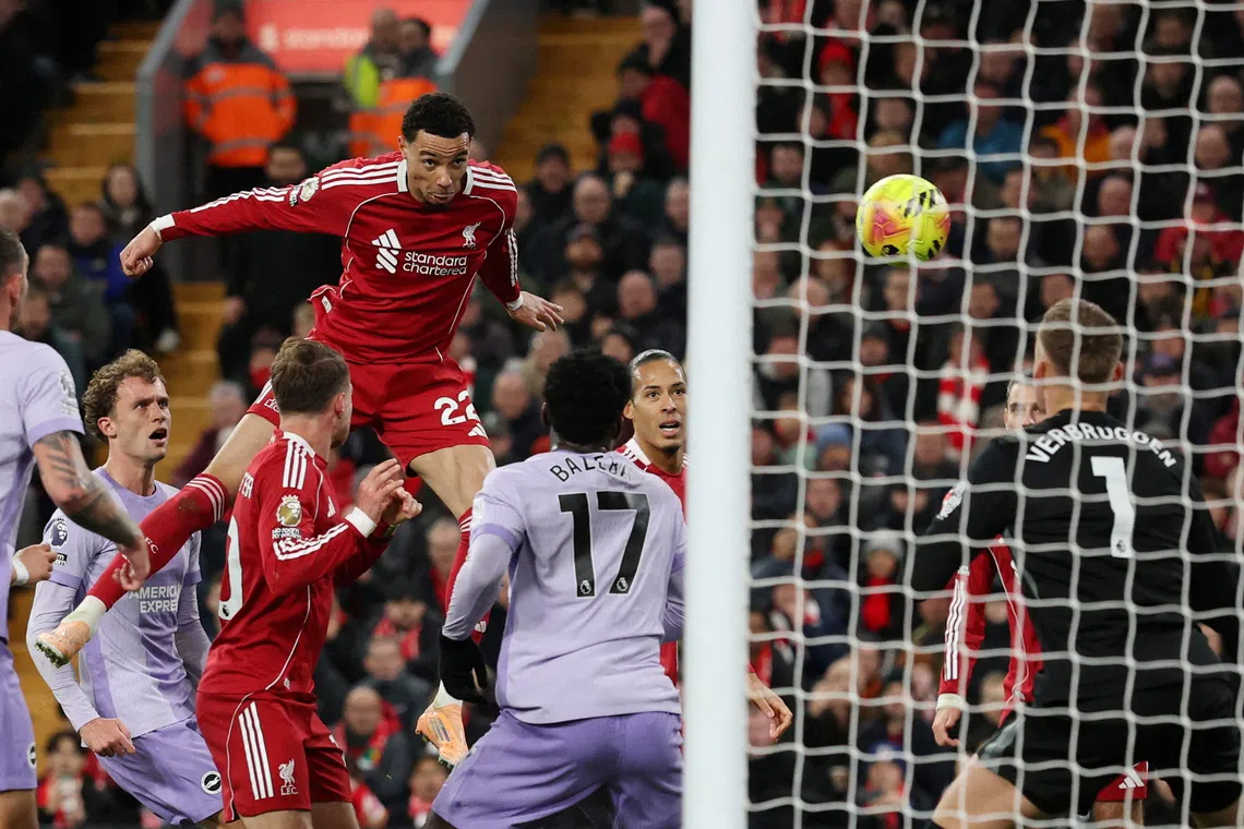 Soccer Football - Premier League - Liverpool v Brighton & Hove Albion - Anfield, Liverpool, Britain - December 13, 2025 Liverpool's Hugo Ekitike scores their second goal past Brighton & Hove Albion's Bart Verbruggen REUTERS/Phil Noble