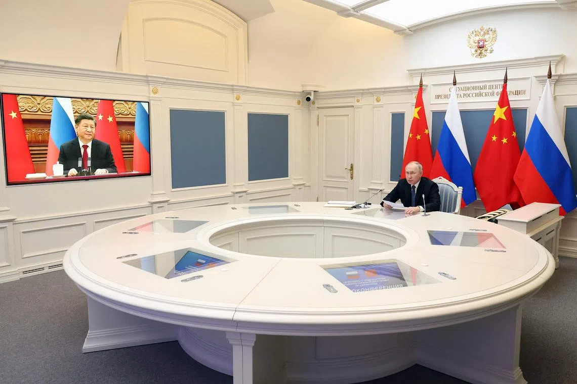 Russian President Vladimir Putin holds a meeting with Chinese President Xi Jinping via a video link at the Kremlin on Dec 30, 2022.