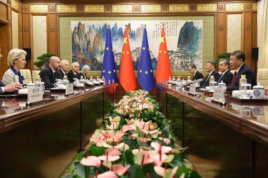 This handout photo taken and released by the European Council Press Service on December 7, 2023 shows China's President Xi Jinping (R) speaking next to China's Foreign Minister Wang Yi (2nd R) at a meeting with Commission President Ursula von der Leyen (L), European Council President Charles Michel (2nd L) and European Union High Representative for Foreign Affairs and Security Policy Josep Borrell (3rd L) during the 24th EU–China Summit in Beijing. (Photo by Dario Pignatelli / EUROPEAN COUNCIL PRESS SERVICE / AFP) / RESTRICTED TO EDITORIAL USE - MANDATORY CREDIT "AFP PHOTO /  EUROPEAN COUNCIL PRESS SERVICE / DARIO PIGNATELLI" - NO MARKETING NO ADVERTISING CAMPAIGNS - DISTRIBUTED AS A SERVICE TO CLIENTS