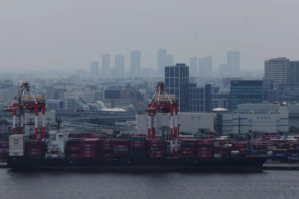 FILE PHOTO: Containers on a cargo ship are pictured at an industrial port in Tokyo, Japan, July 2, 2025.   REUTERS/Kim Kyung-Hoon/File Photo