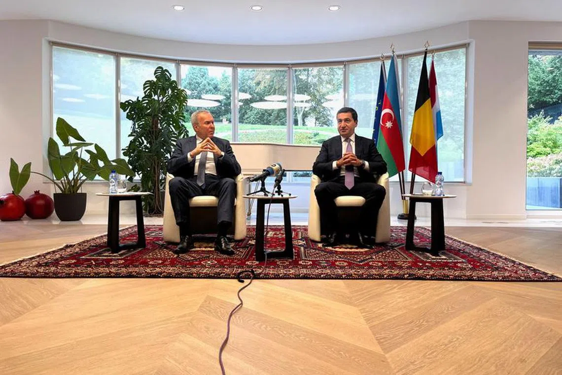 Hikmet Hajiyev, foreign policy adviser to Azerbaijan's President Ilham Aliyev and Vaqif Sadiqov, Ambassador of the Republic of Azerbaijan to Belgium and Luxembourg and Head of Mission to EU talk to reporters in Brussels, Belgium September 26, 2023.  REUTERS/Bart Biesemans