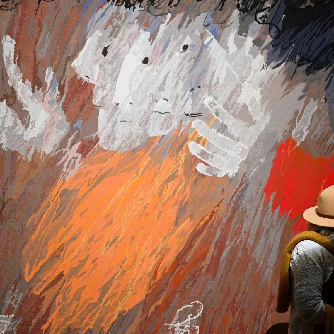 A guest viewing a tapestry during a media preview of the major winter exhibition Arthur Boyd: Tapestries at the National Gallery of Australia in Canberra, Australia, June 18, 2026. 