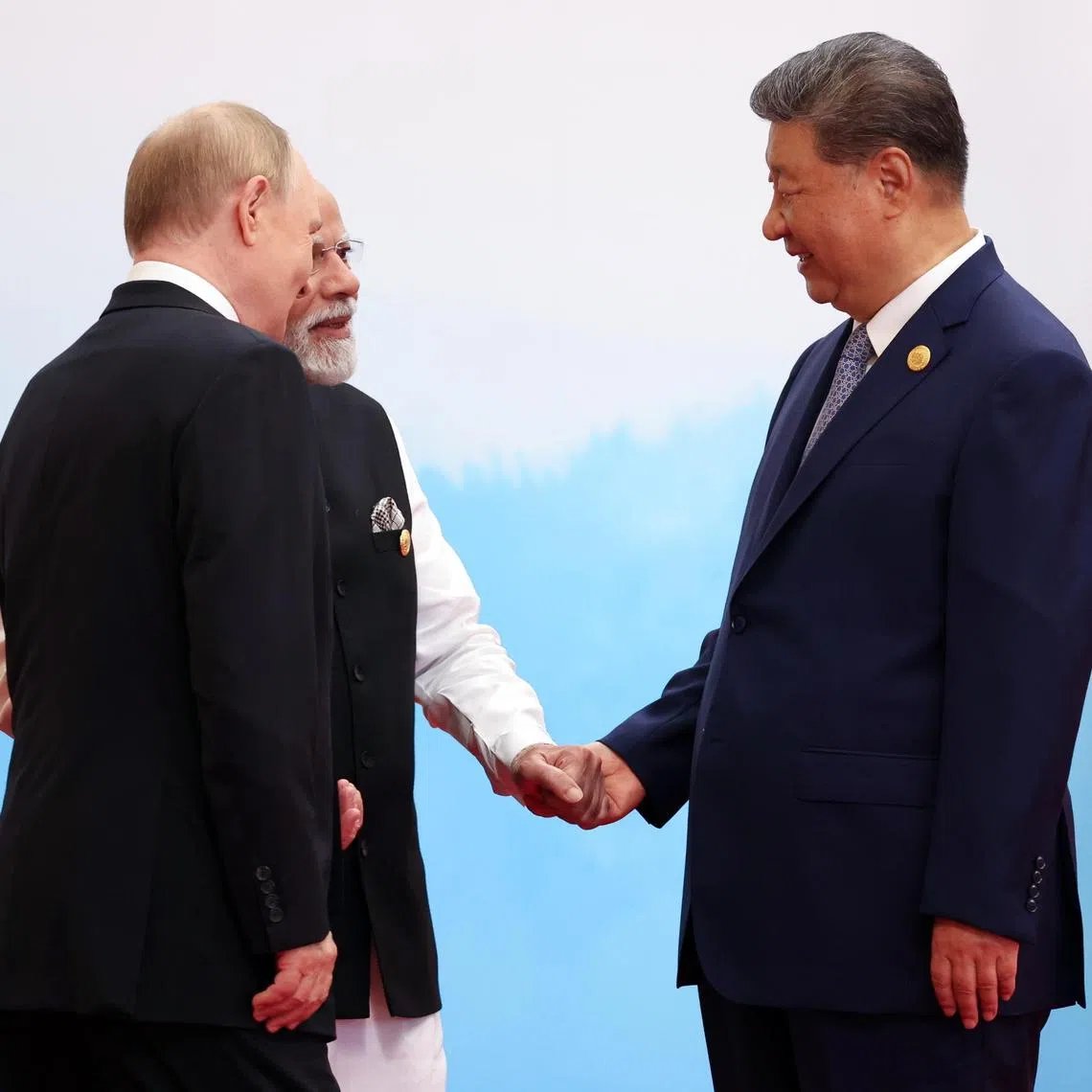 Chinese President Xi Jinping with Indian Prime Minister Narendra Modi and Russian President Vladimir Putin at the Shanghai Cooperation Organization (SCO) summit in Tianjin, on Sept 1.