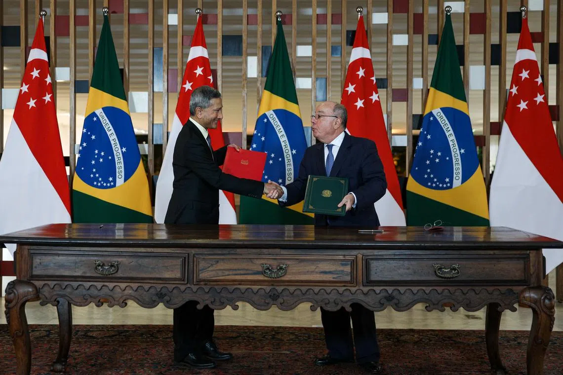 Minister for Foreign Affairs Dr Vivian Balakrishnan and Brazil Minister of Foreign Affairs shake hands after  signing the Memorandum of Understanding on the Brazil-Singapore cooperation programme to third countries.
