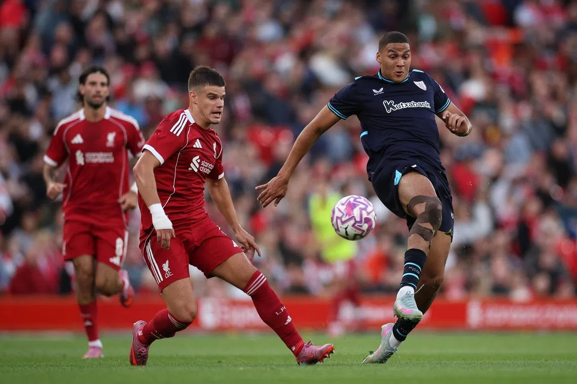 Maroan Sannadi of Athletic Club (right) in action against Milos Kerkez of Liverpool  during a pre-season friendly match on Aug 4.