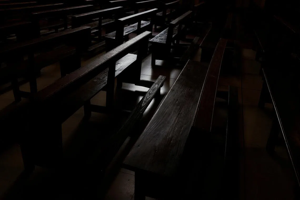 Empty pews are seen inside a Catholic church in Madrid, Spain, October 27, 2023.REUTERS/Susana Vera/File Photo