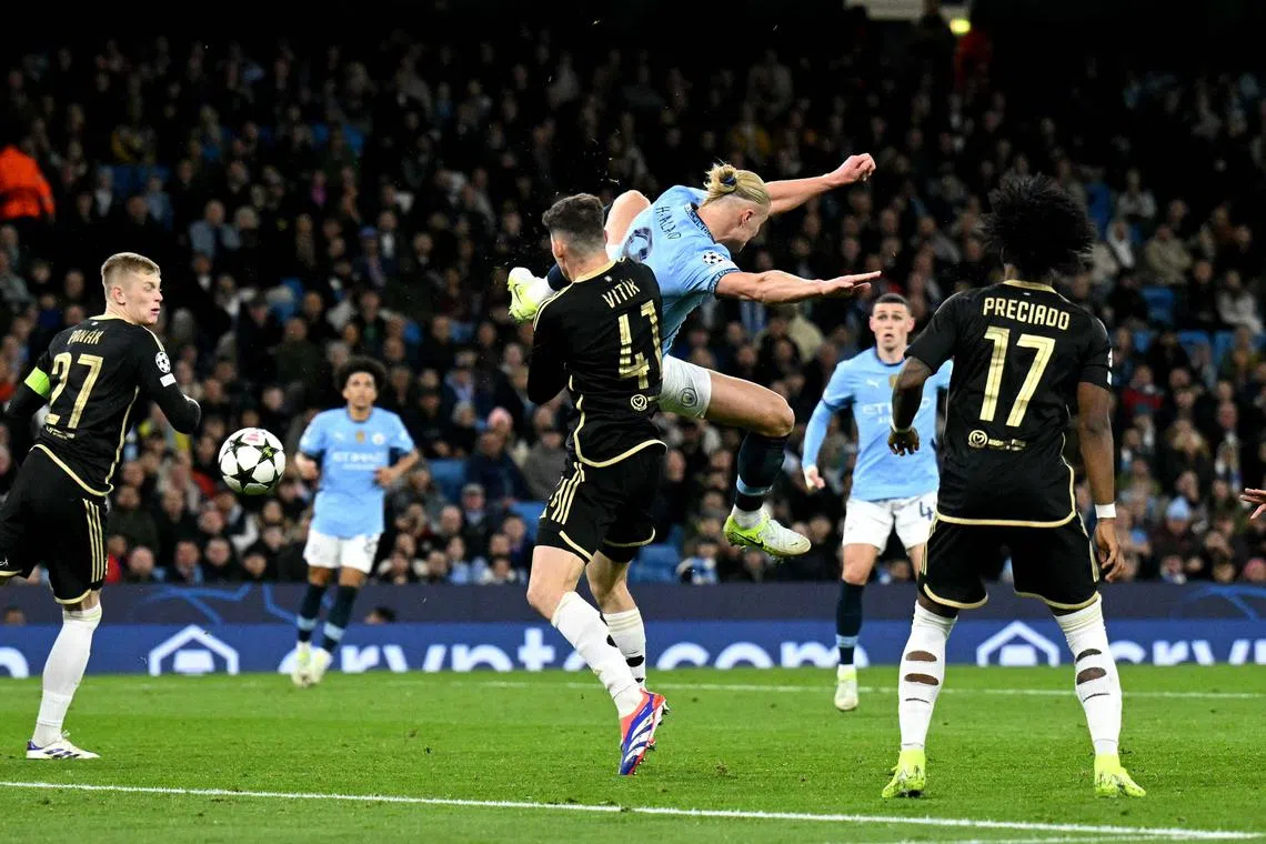 Manchester City's Erling Haaland scores an acrobatic goal in the 5-0 Champions League win over Sparta Prague.