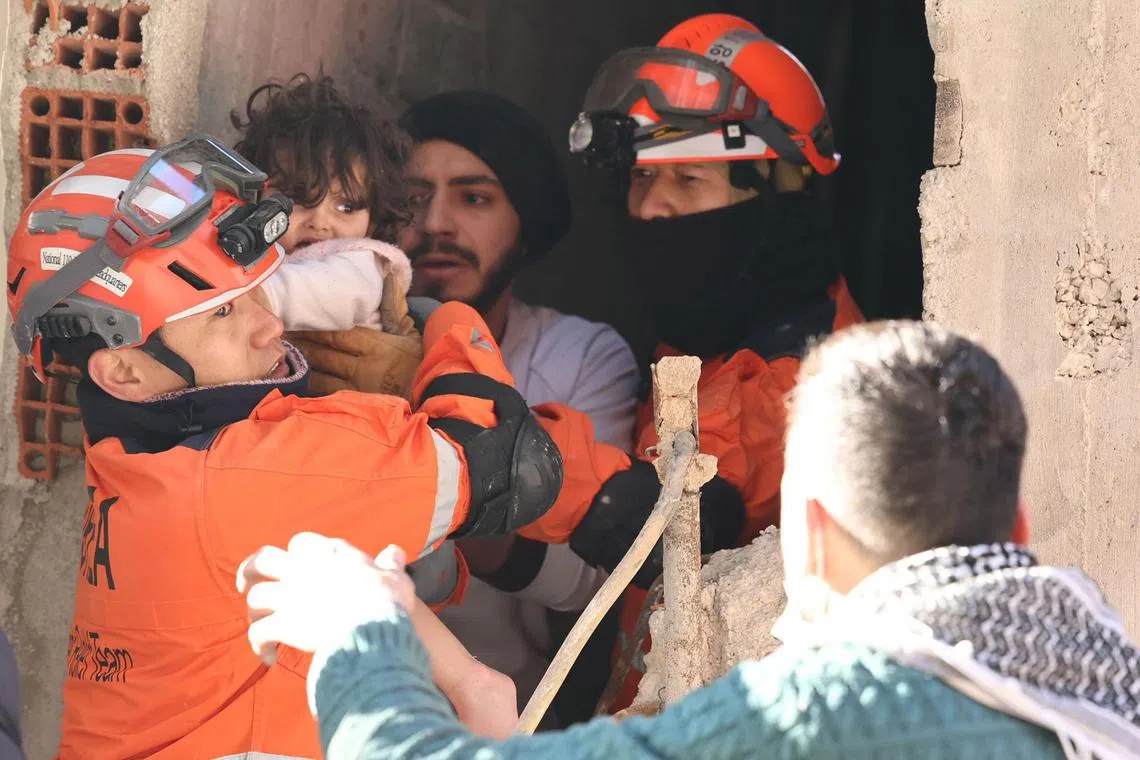 epa10456040 Members of a South Korean disaster relief team rescue a toddler in Antakya, Hatay province, Turkey, 09 February 2023, after a deadly 7.8 magnitude earthquake hit Turkey and Syria on 06 February.  EPA-EFE/YONHAP SOUTH KOREA OUT