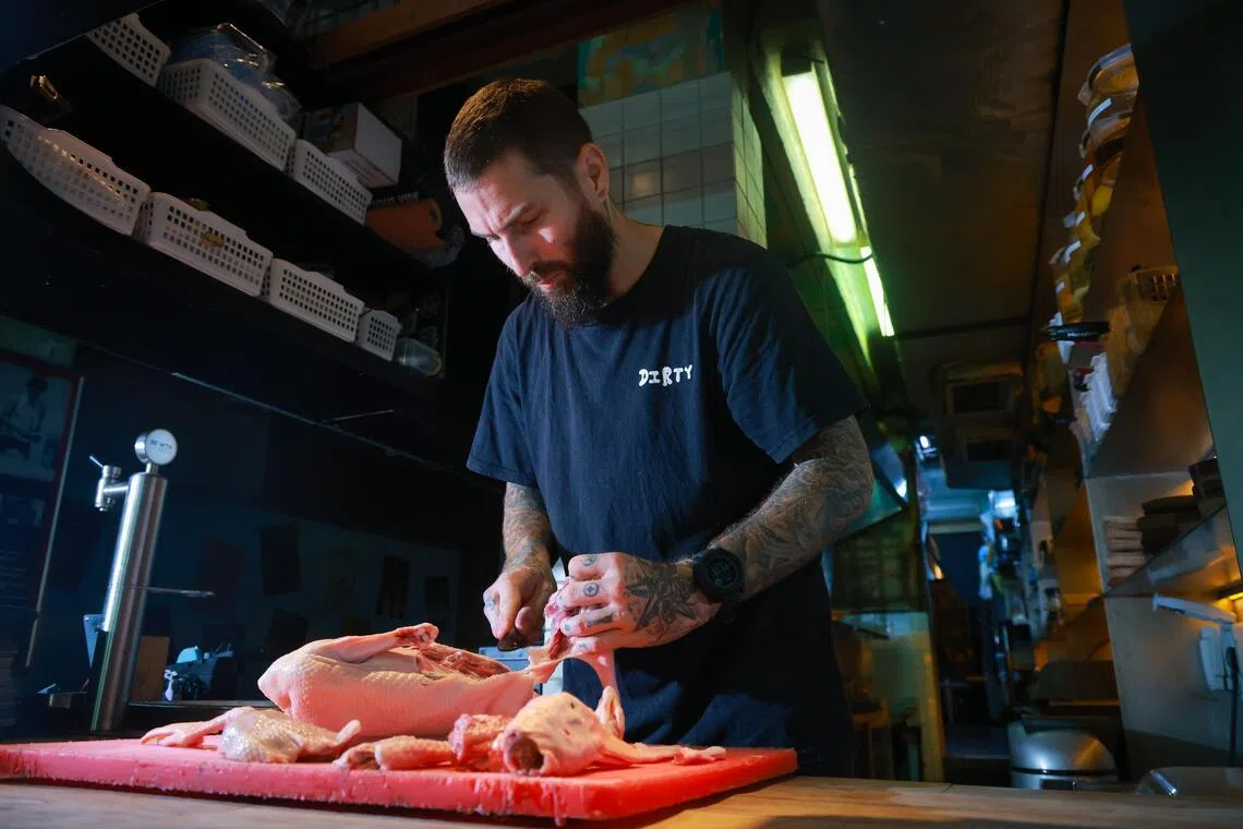 Chef Peter Smit of Dirty Supper preparing a duck on Aug 18.