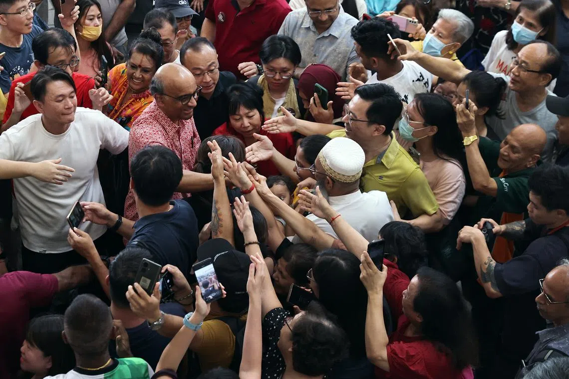 President-elect Tharman Shanmugaratnam and his wife Jane Ittogi being mobbed by supporters at Toa Payoh Hub on Sept 2.