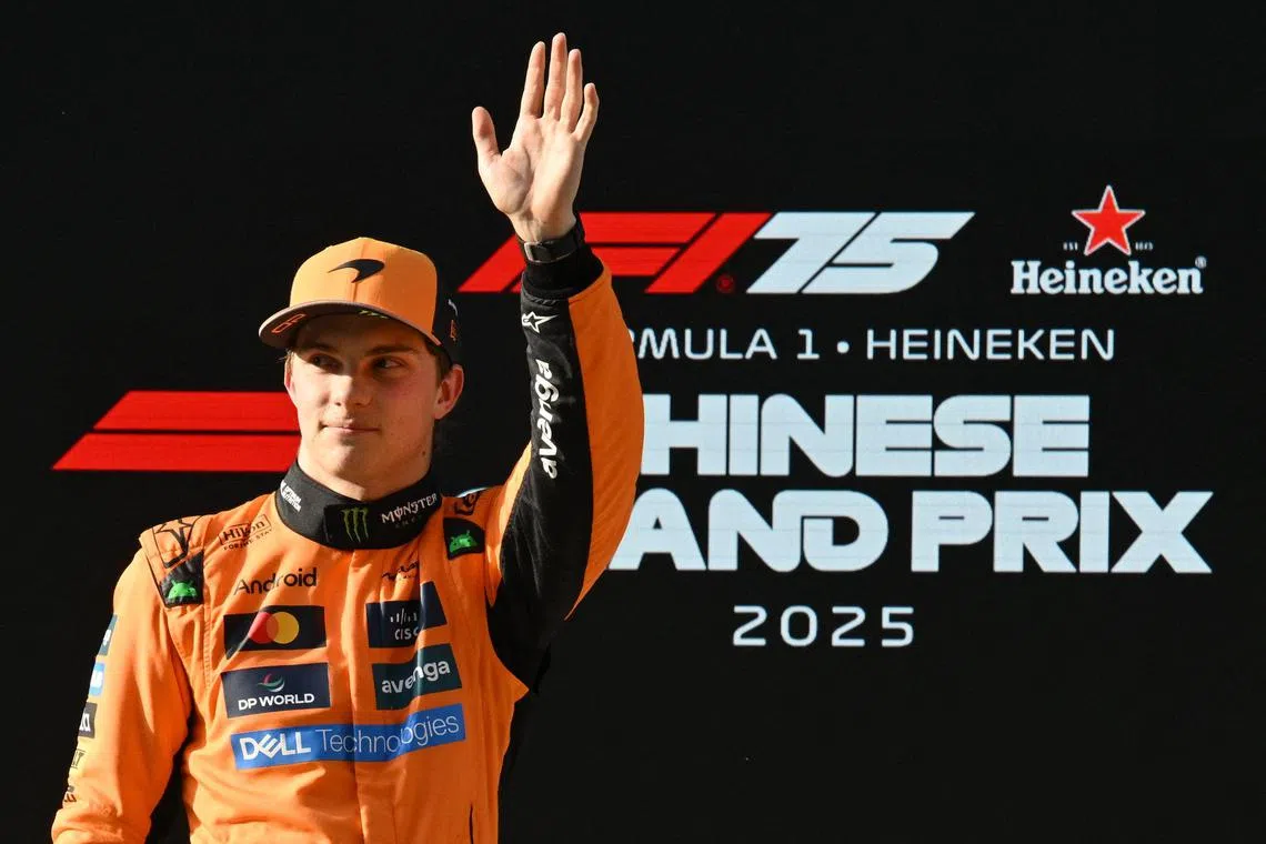 McLaren's Oscar Piastri celebrates after taking pole position for the Chinese Grand Prix in Shanghai on March 22.