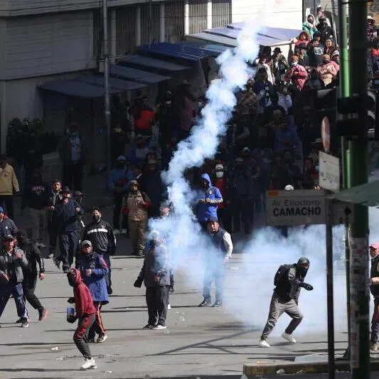 Protesters clash with members of the Bolivian police during a protest calling for the resignation of Bolivian President Rodrigo Paz in La Paz, on May 25.
