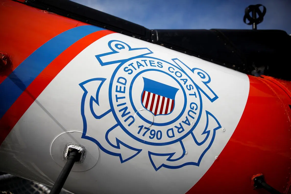 The U.S. Coast Guard's logo is seen on an helicopter on the deck of the Coast Guard Cutter Hamilton at Port Everglades, in Fort Lauderdale, Florida, U.S. November 22, 2021. REUTERS/Marco Bello/File Photo