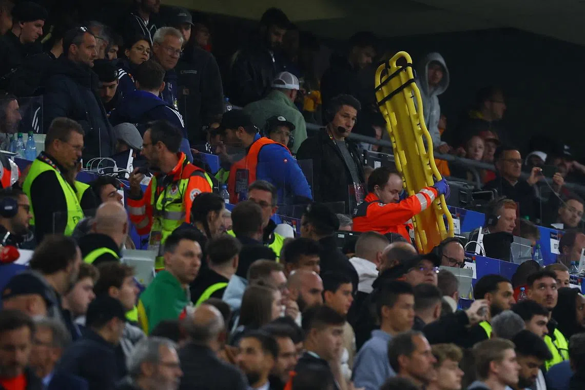 Soccer Football - Nations League - Final - Portugal v Spain - Allianz Arena, Munich, Germany - June 8, 2025 Paramedics brings a stretcher in the stands after an incident with a fan during the match REUTERS/Kai Pfaffenbach