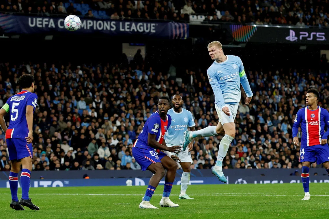 Manchester City’s Erling Haaland scores their first goal.