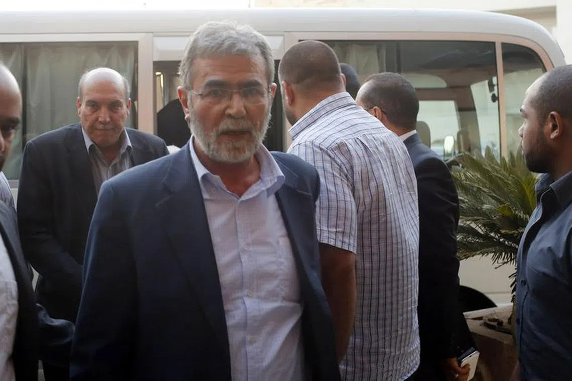 FILE PHOTO: Ziad Al-Nakhala, Islamic Jihad's deputy leader, arrives at a hotel with other Palestinian negotiators after negotiations in Cairo August 13, 2014. REUTERS/Asmaa Waguih/File Photo