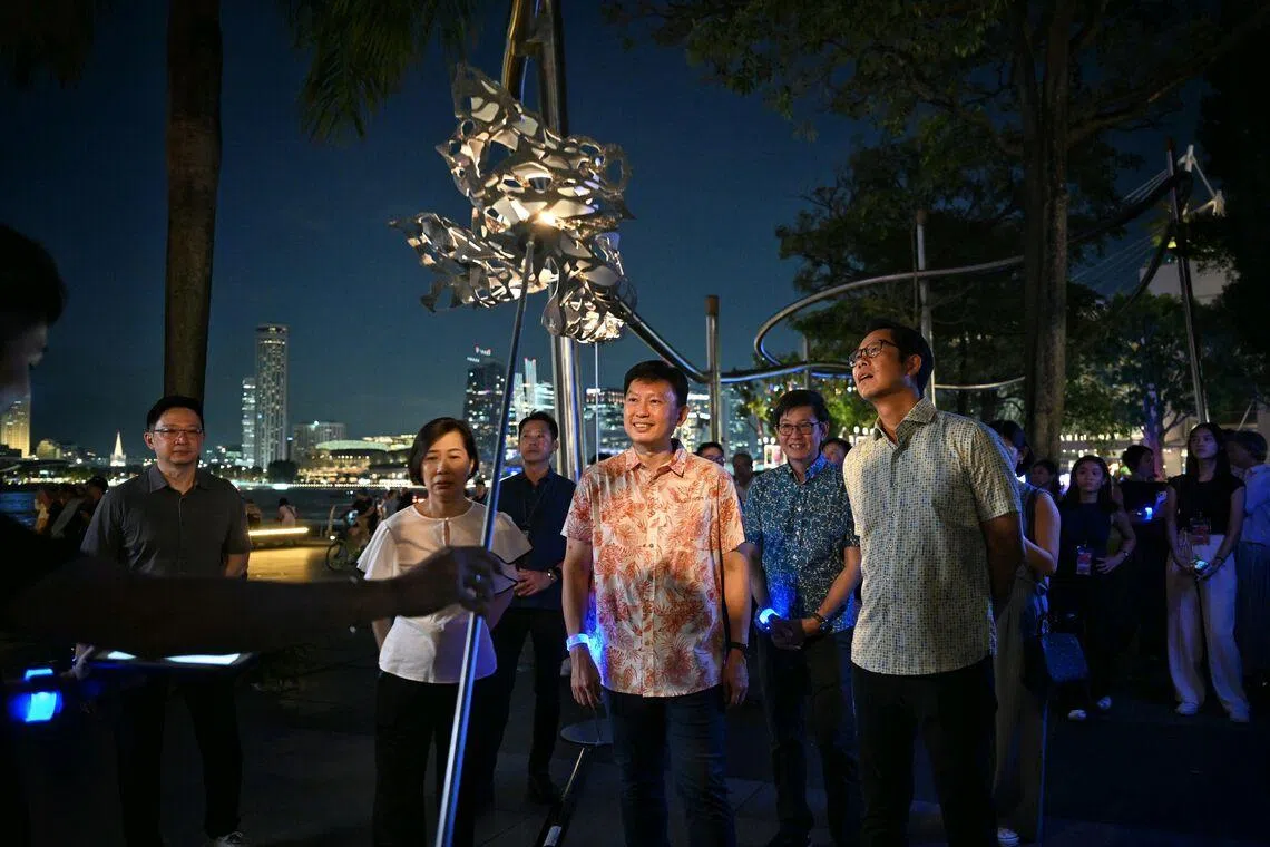 National Development Minister Chee Hong Tat viewing Where the Wildflowers Grow, an interactive light art installation by Singaporean artists Kester Wong and Tan Shao Qi, at the i Light Singapore festival on June 5.