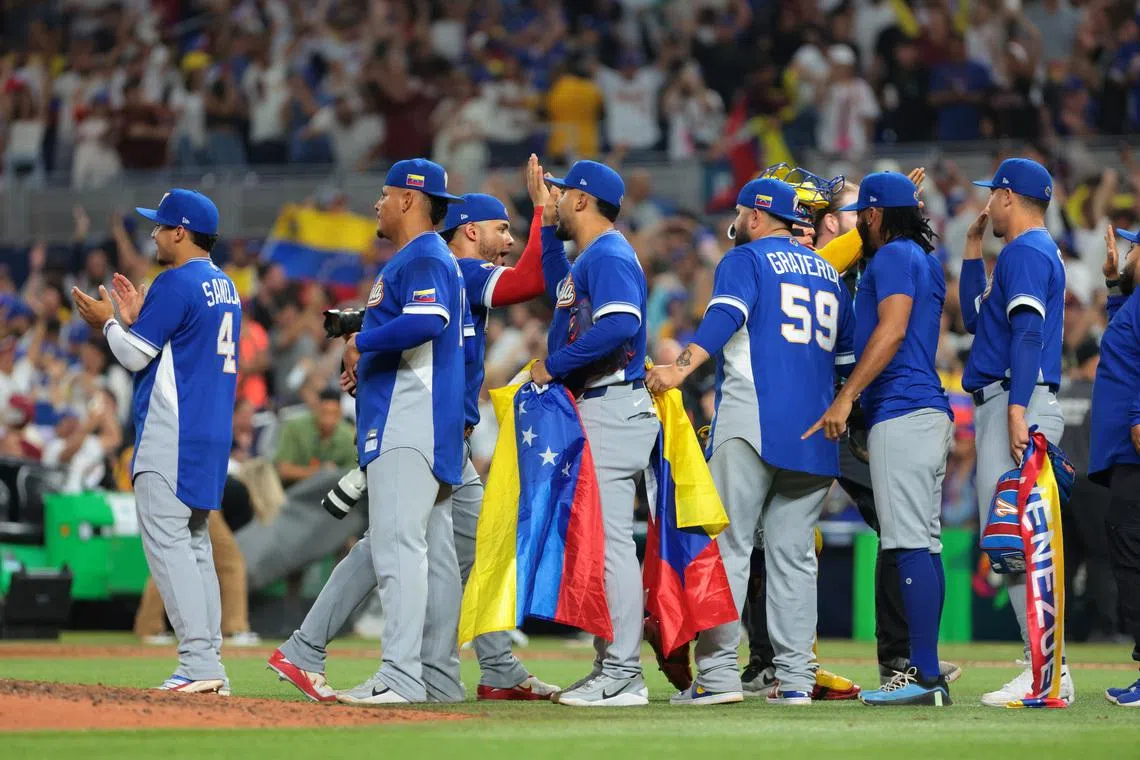 Mar 16, 2026; Miami, FL, United States; Team Venezuela celebrates after defeating Italy in a semifinal game of the 2026 World Baseball Classic at loanDepot Park. Mandatory Credit: Sam Navarro-Imagn Images