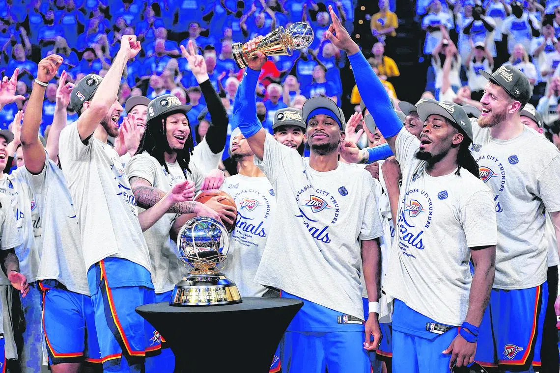 The Oklahoma City Thunder celebrate after winning the NBA Western Conference Finals.