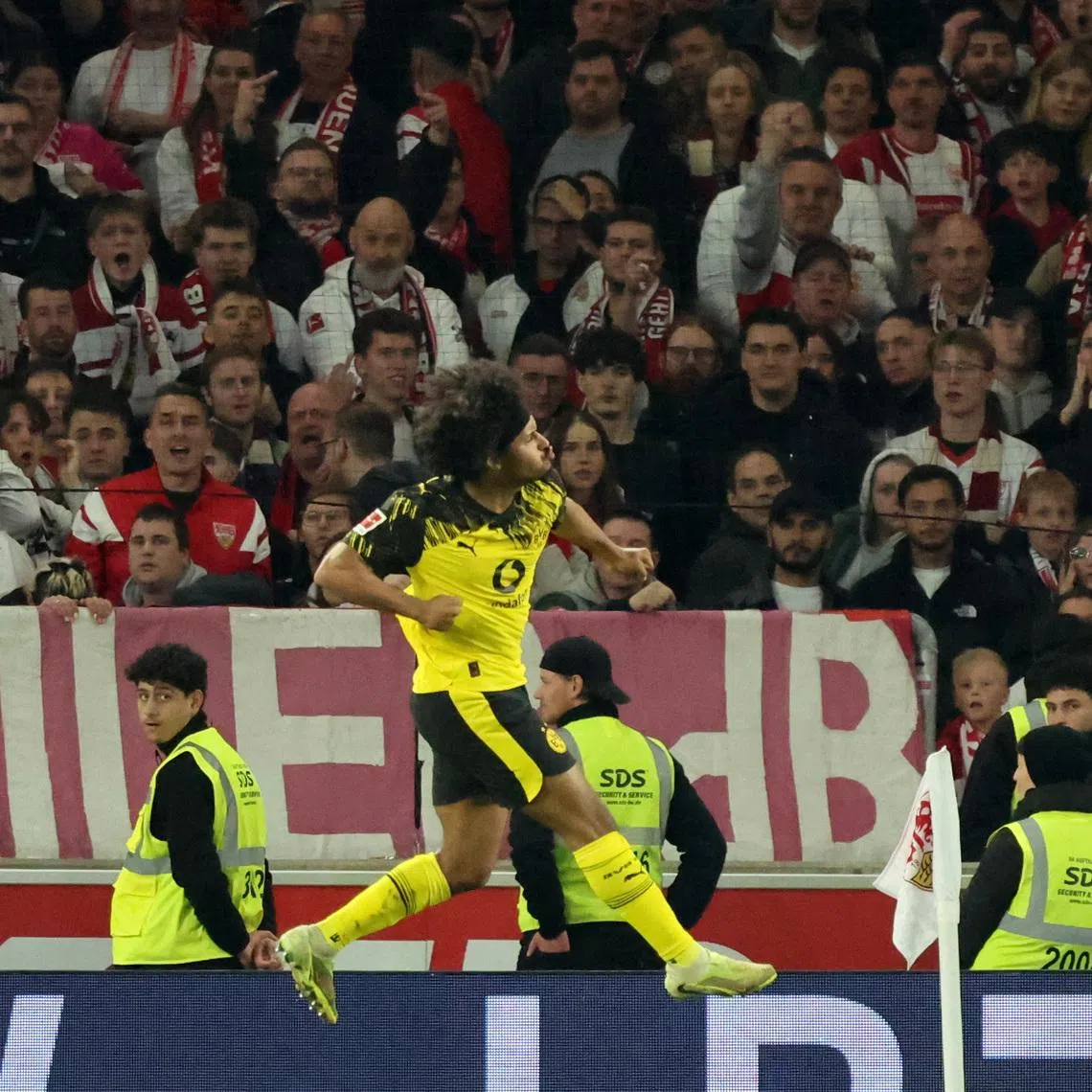 Soccer Football - Bundesliga - VfB Stuttgart v Borussia Dortmund - MHPArena, Stuttgart, Germany - April 4, 2026 Borussia Dortmund's Karim Adeyemi celebrates scoring their first goal REUTERS/Robin Rudel