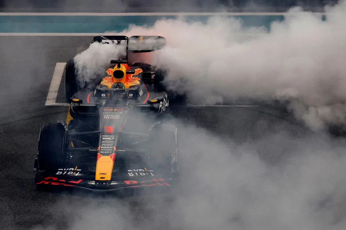 Red Bull's Max Verstappen celebrating after winning the Abu Dhabi Grand Prix at the Yas Marina Circuit, Abu Dhabi, United Arab Emirates on Nov 26, 2023.