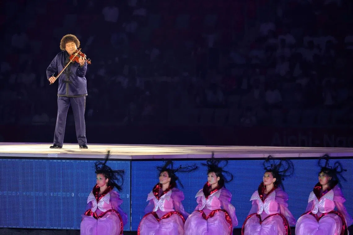 A performance titled Welcome Aichi-Nagoya: Awakening of the Space and The Resonating Heart Beat, featuring violinist Taro Hakase (pictured on platform).