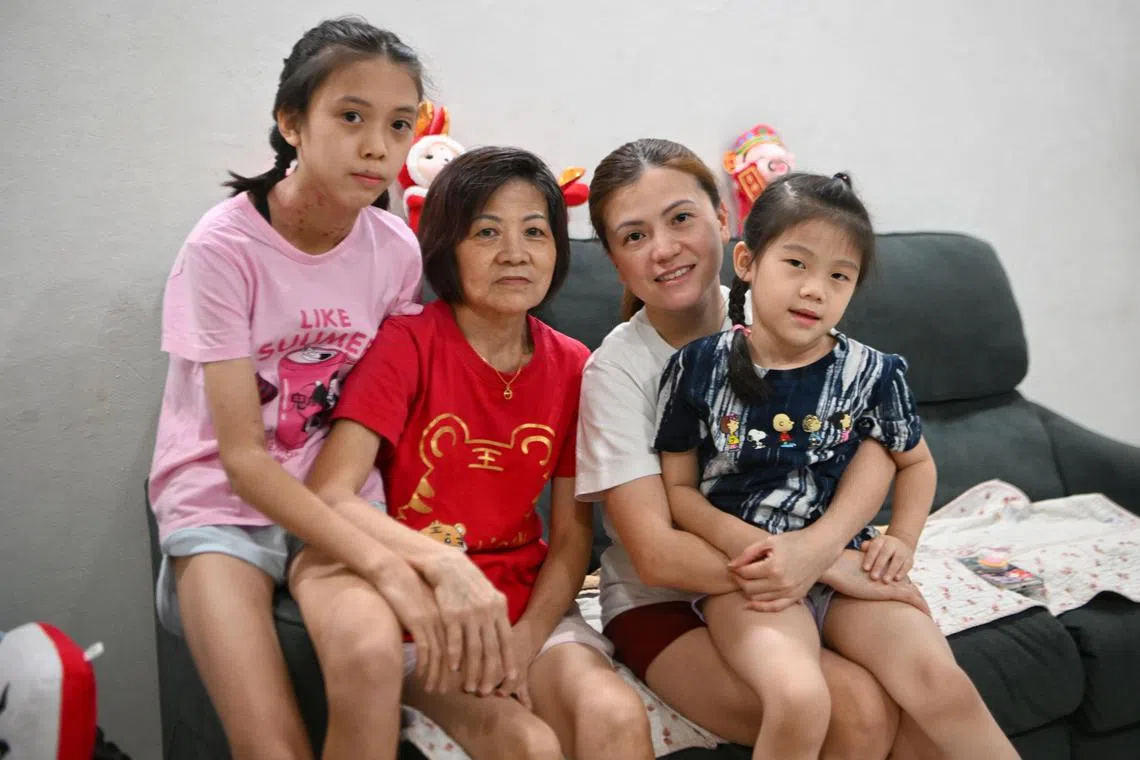 Ms Lim Xiaoli (second left) with (from left) her elder daughter Kaelyn, mother Ong Kim Hong and younger daughter Kayenne.