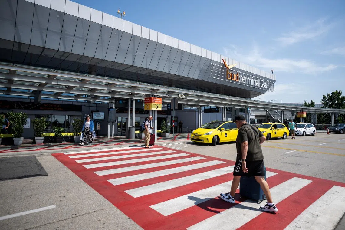 A man walks outside Ferenc Liszt International Airport's terminal 2A in Budapest, Hungary, July 9, 2024. REUTERS/Marton Monus