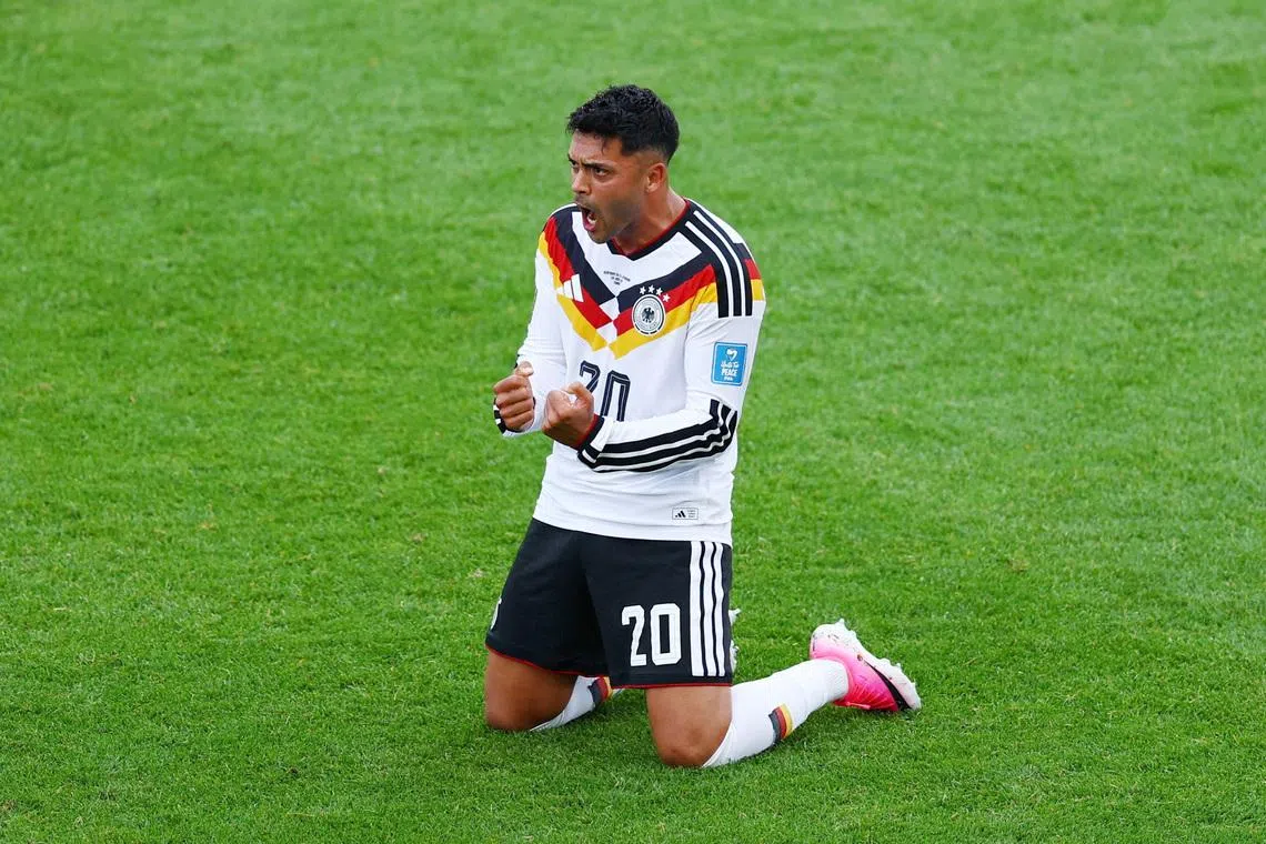 Germany's Nadiem Amiri celebrates after the 2-1 comeback win over Ivory Coast on June 20.