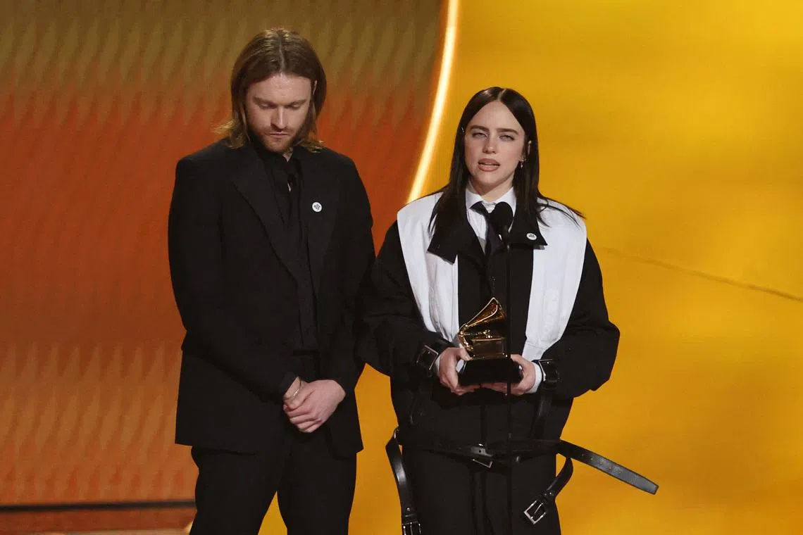 Billie Eilish and Finneas O’Connell accept the Song Of The Year award for Wildflower onstage during the 68th Grammy Awards on Feb 1.