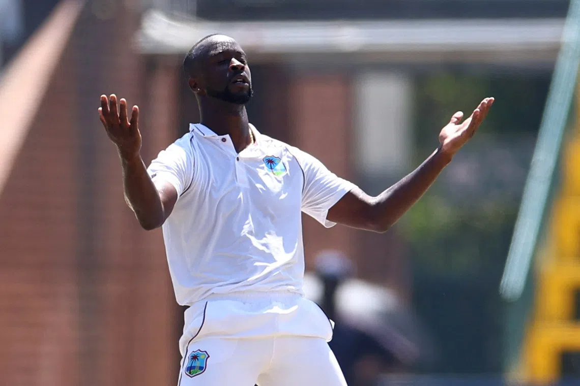 Cricket - Second Test - South Africa v West Indies - Wanderers Stadium, Johannesburg, South Africa - March 10, 2023 West Indies' Kemar Roach celebrates after taking the wicket of South Africa's Aiden Markram REUTERS/Siphiwe Sibeko