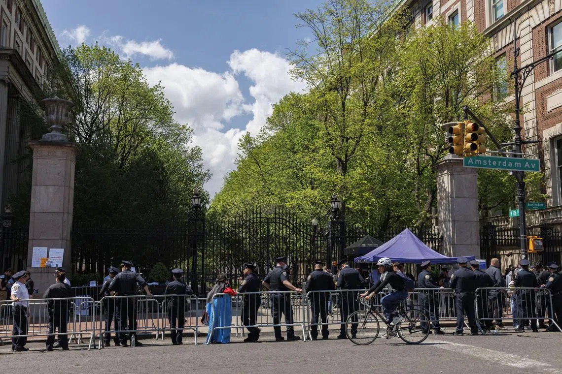 Police officers gather outside Columbia University campus on Amsterdam Avenue in New York on May 1. 