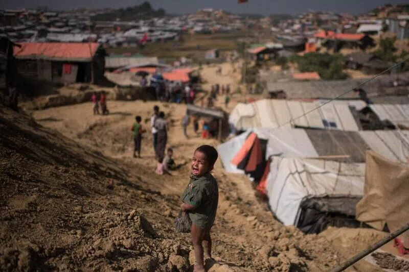 A Rohingya refugee child standing near a refugee camp at Cox's Bazar, Bangladesh.