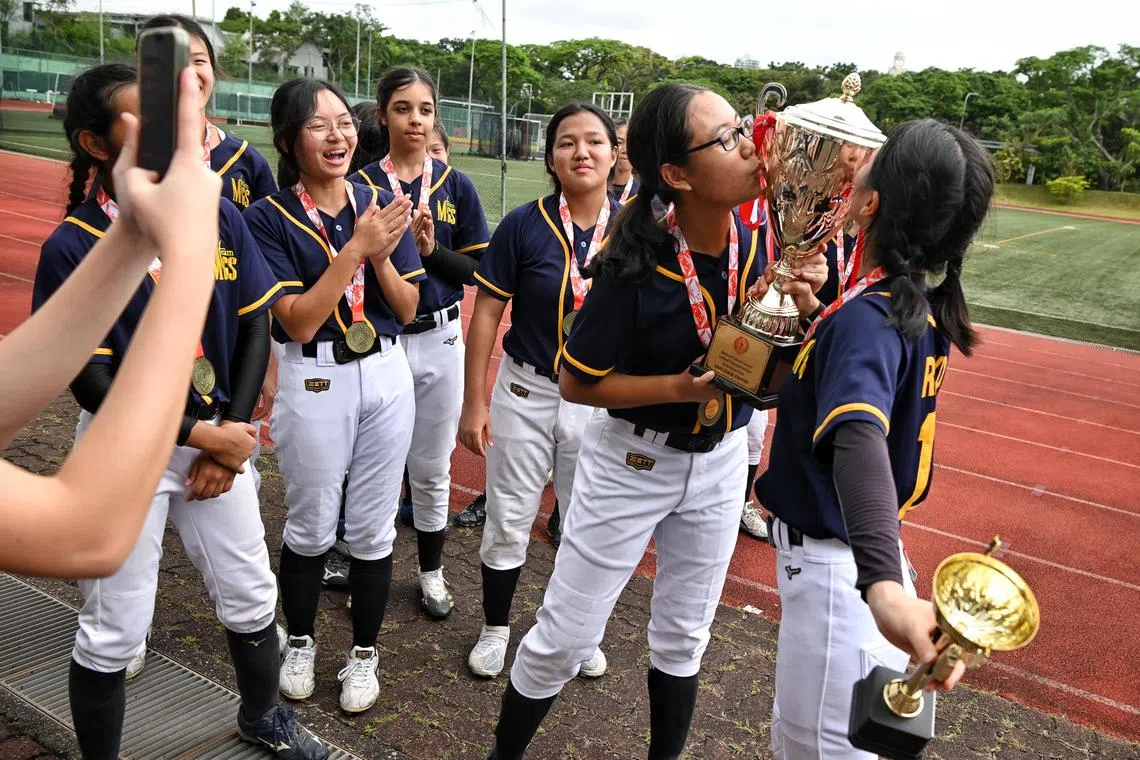 Players from Methodist Girls’ School celebrating their fifth straight win in the National B Division girls’ softball final after defeating Dunman High School on March 1.
