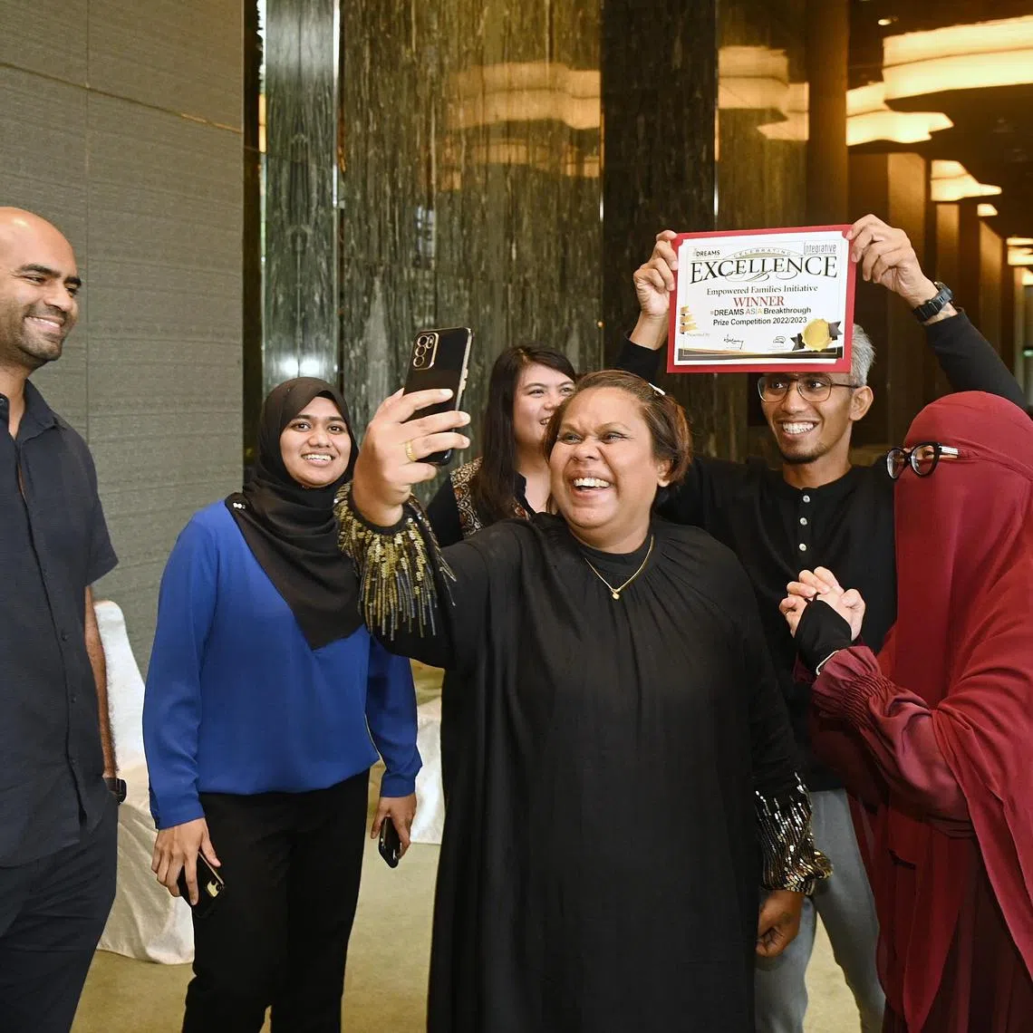 The team behind the Empowered Families Initiative, which offers families living in public rental flats money to use in a way they themselves believe will work to improve their lot.