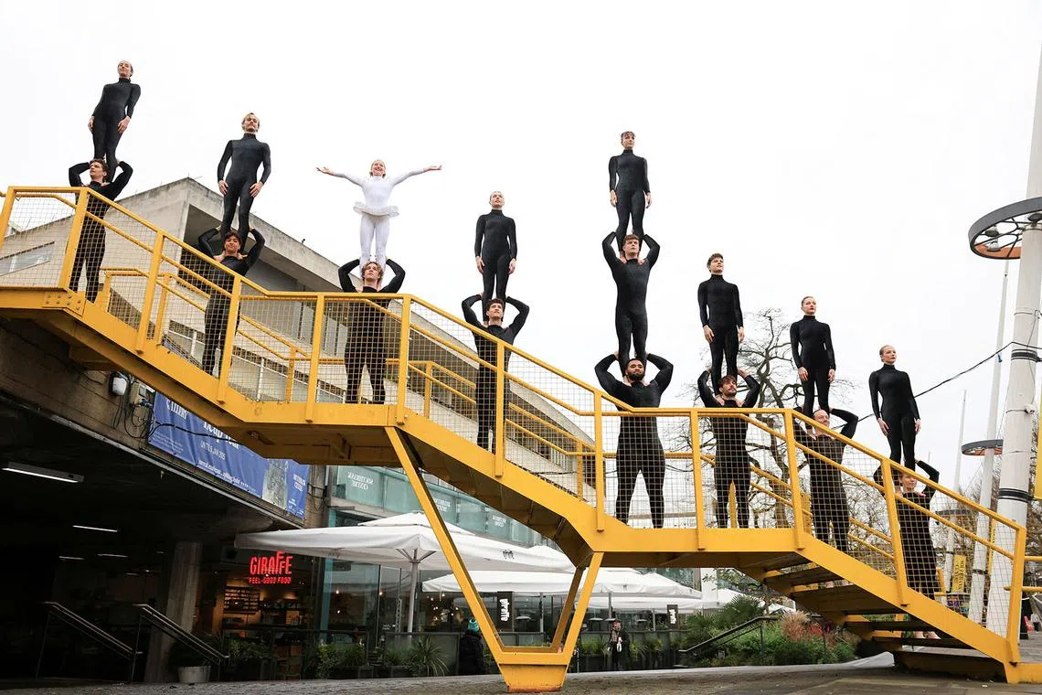 Acrobats from Circa performing a stunt on the South Bank, ahead of the premiere of Duck Pond, in London, Britain, Dec 17, 2024. 