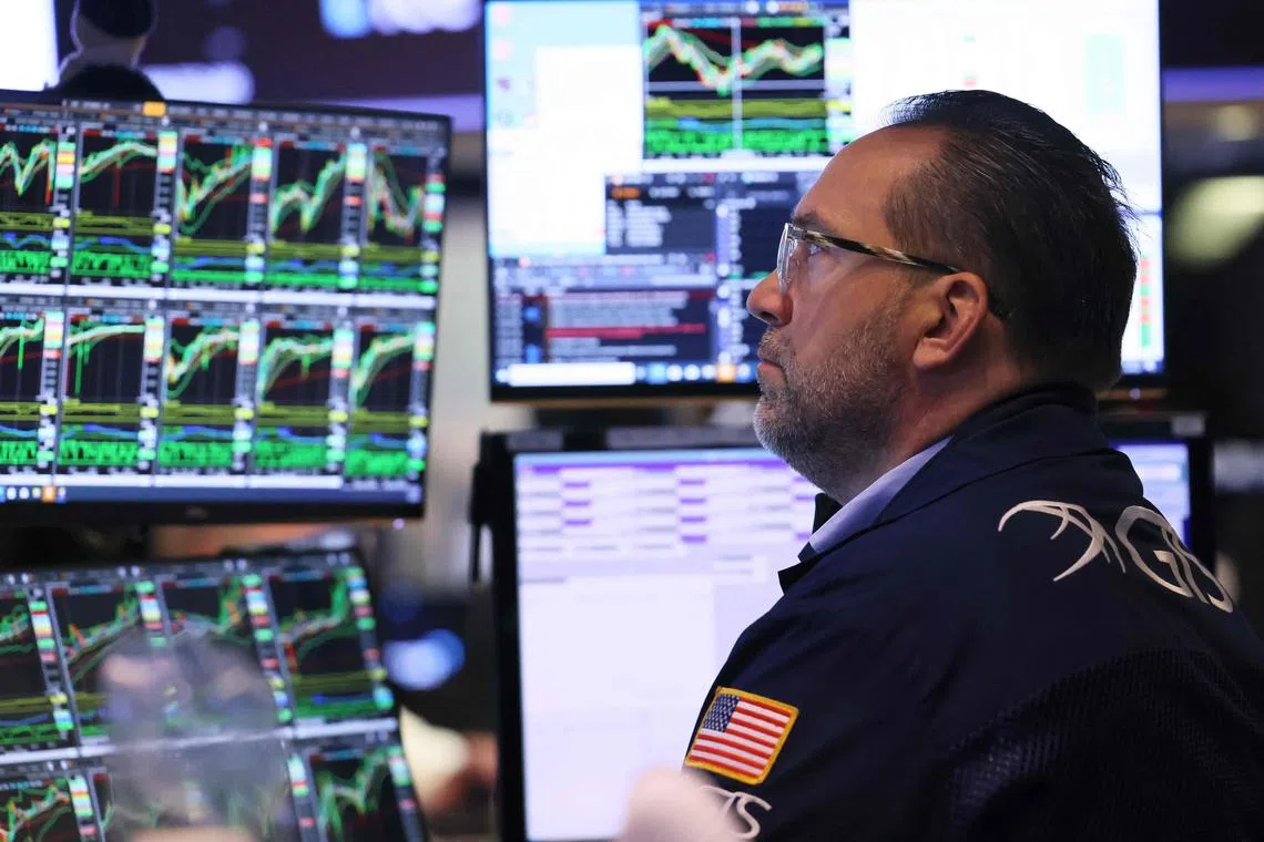 Traders work on the floor of the New York Stock Exchange.