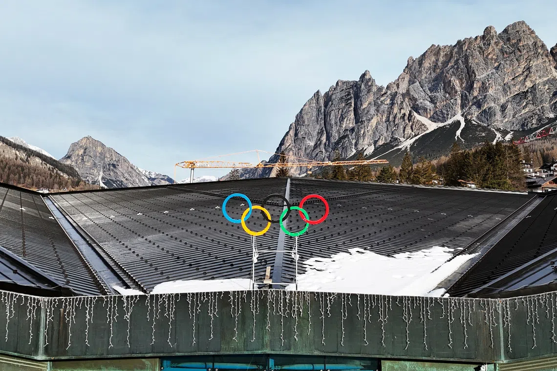 An aerial view shows the Olympics rings on the Cortina Curling Olympic Stadium, which will host the curling, wheelchair curling, and Paralympic closing ceremony, during the Milano Cortina Winter Olympic Games 2026, in Cortina, Italy, January 25, 2025. REUTERS/Claudia Greco
