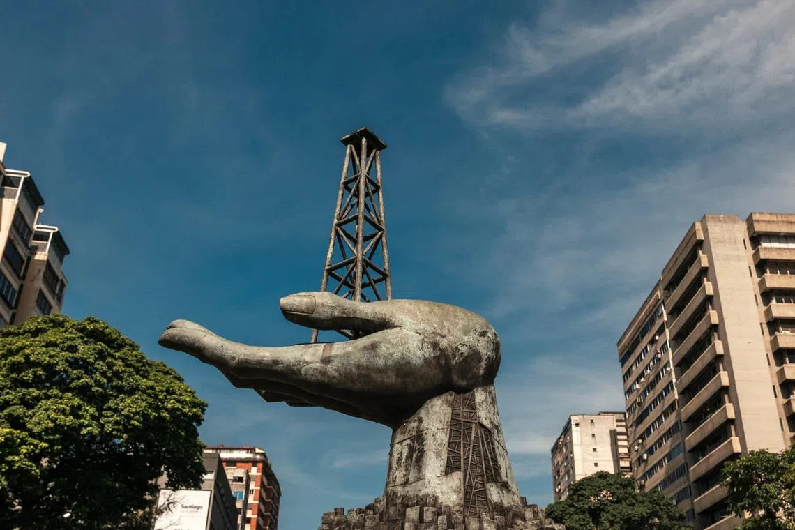 A statue of a hand holding a drilling rig near the headquarters of PDVSA, Venezuela's state oil company, in Caracas.