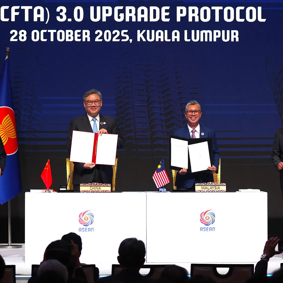 Malaysia's Investment, Trade and Industry Minister Tengku Zafrul Aziz (right) and Chinese Commerce Minister Wang Wentao signed the pact in Kuala Lumpur on Oct 28.