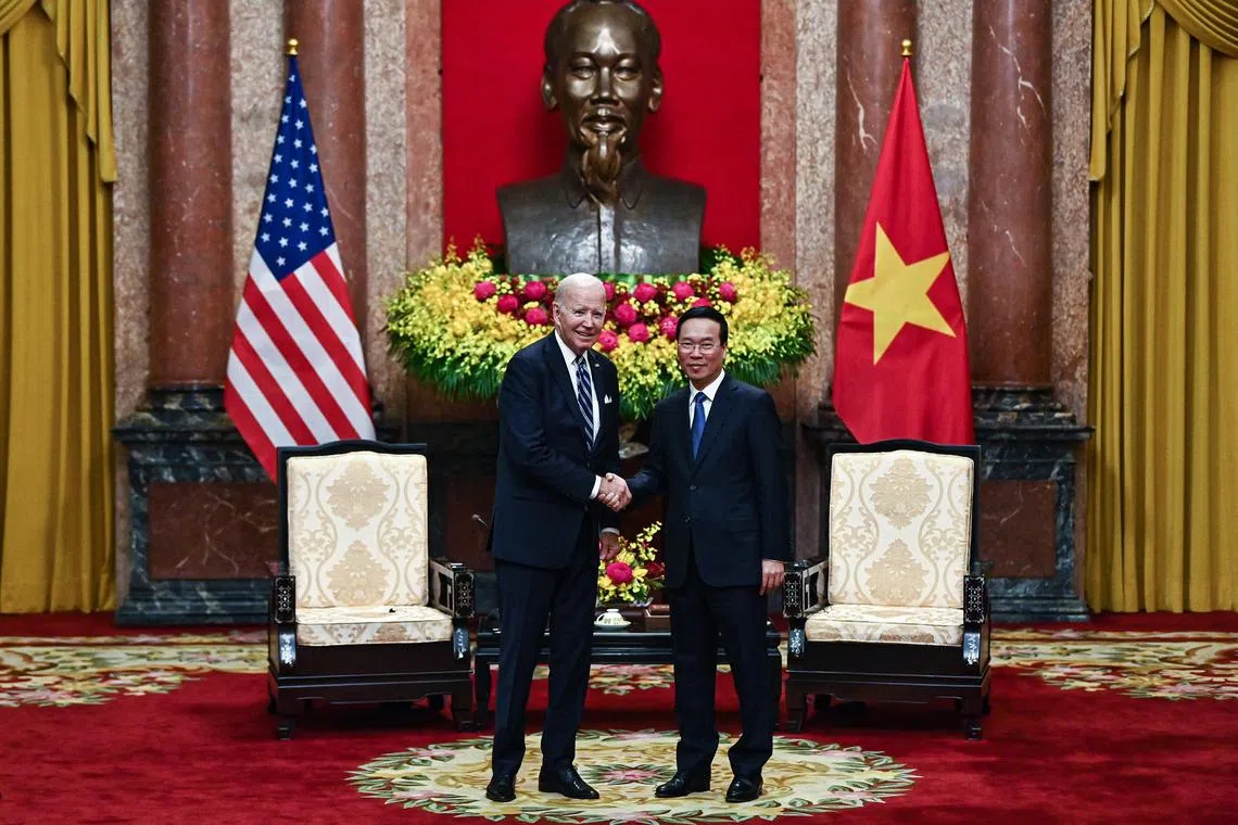 Vietnam's President Vo Van Thuong (R) shakes hands with US President Joe Biden during a meeting at the Presidential Palace in Hanoi, Vietnam, 11 September 2023. Biden arrived in Hanoi after attending the Group of 20 summit in India.