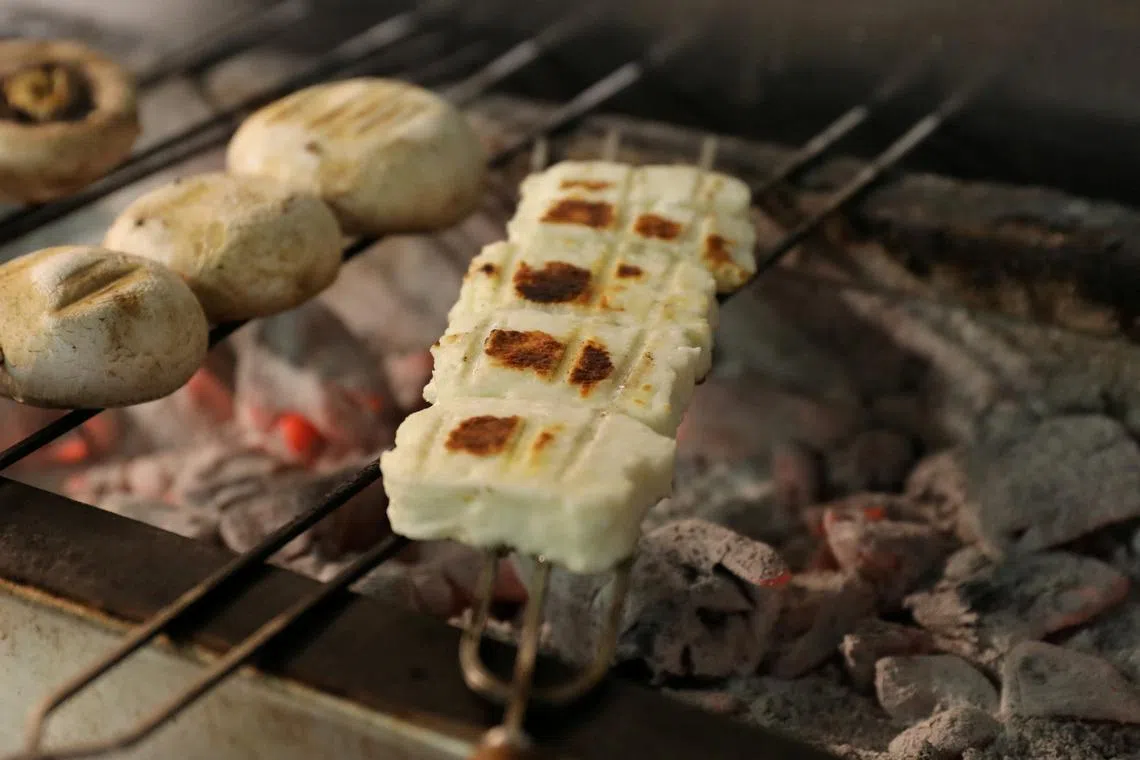 FILE PHOTO: Grilled halloumi is seen in a restaurant in Nicosia, Cyprus, April 2, 2021. Picture taken April 2, 2021. REUTERS/Yiannis Kourtoglou