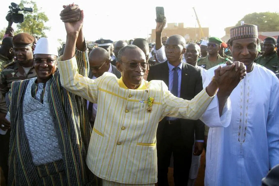 FILE PHOTO: Prime Minister of Niger, Ali Mahamane Lamine Zeine, Prime Minister of Burkina Faso Apollinaire Joachim Kyelem de Tambela and Prime Minister of Mali Choguel Kokalla Maiga attend a sit-in in Niamey, Niger, December 29, 2023. REUTERS/Mahamadou Hamidou/File Photo