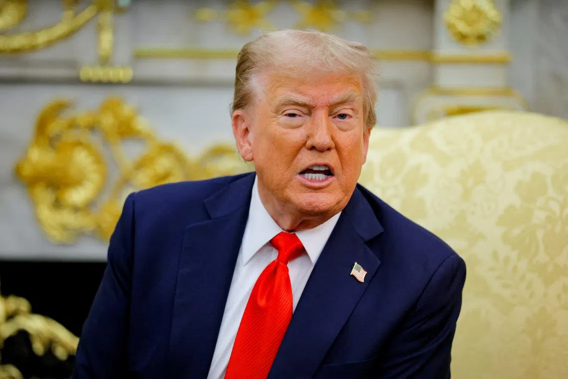 FILE PHOTO: U.S. President Donald Trump reacts as he and the President of Poland Karol Nawrocki (not pictured) meet in the Oval Office at the White House in Washington, D.C., U.S., September 3, 2025.  REUTERS/Brian Snyder/File Photo