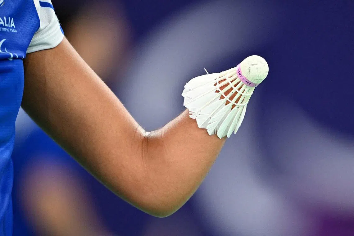 Rosa de Marco of Italy holding a shuttlecock during her match with Thulasimathi Murugesan of India in badminton's women's singles SU5  group play stage at the Paris 2024 Paralympics in France, Aug 29, 2024.