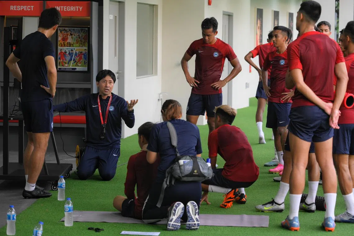 Singapore head coach Takayuki Nishigaya (left) coaches the national football team at Kallang Football Hub on June 12, 2023.