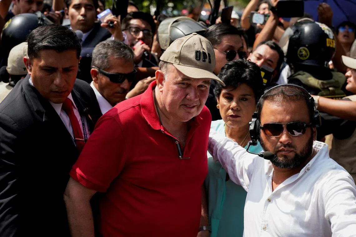 Peru's presidential candidate Rafael Lopez Aliaga leaves after voting at a polling station during the general election, in Lima, Peru April 12, 2026. REUTERS/Leslie Moreno